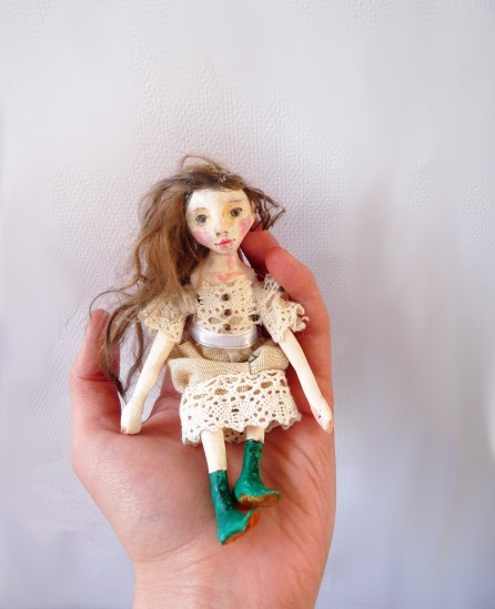 A finished mini doll: Sculpted, painted, sealed, strung, and dressed!