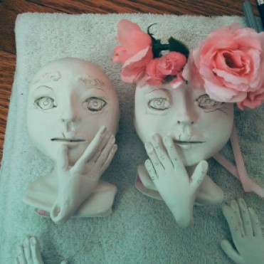 paperclay doll heads and hands with drawn features