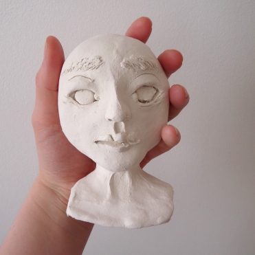 blank sculpt of a paperclay doll head in progress