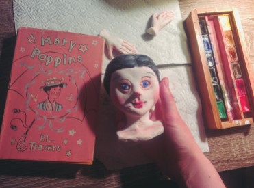 painting a paperclay art doll head of mary poppins