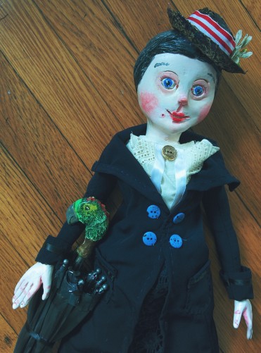 paperclay art doll of mary poppins with her parrot-headed umbrella