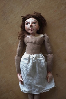 shows the final stage in making a cloth and paperclay art doll