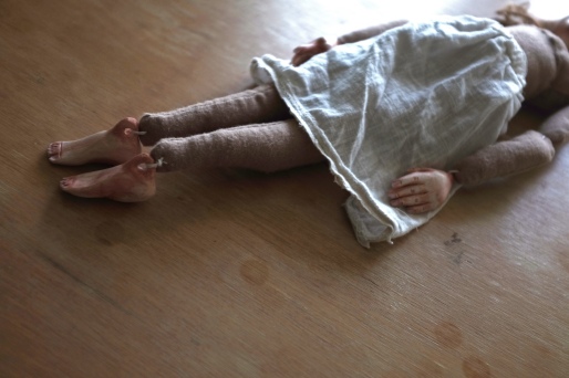 shows jointing on sculpted feet and hands belonging to a cloth art doll