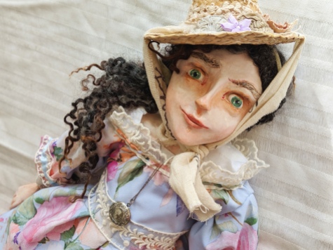 art doll in historic regency costume of blue silk and lace dress and straw hat