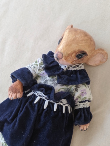 close-up of anthropomorphic miniature mouse art doll in Victorian dress